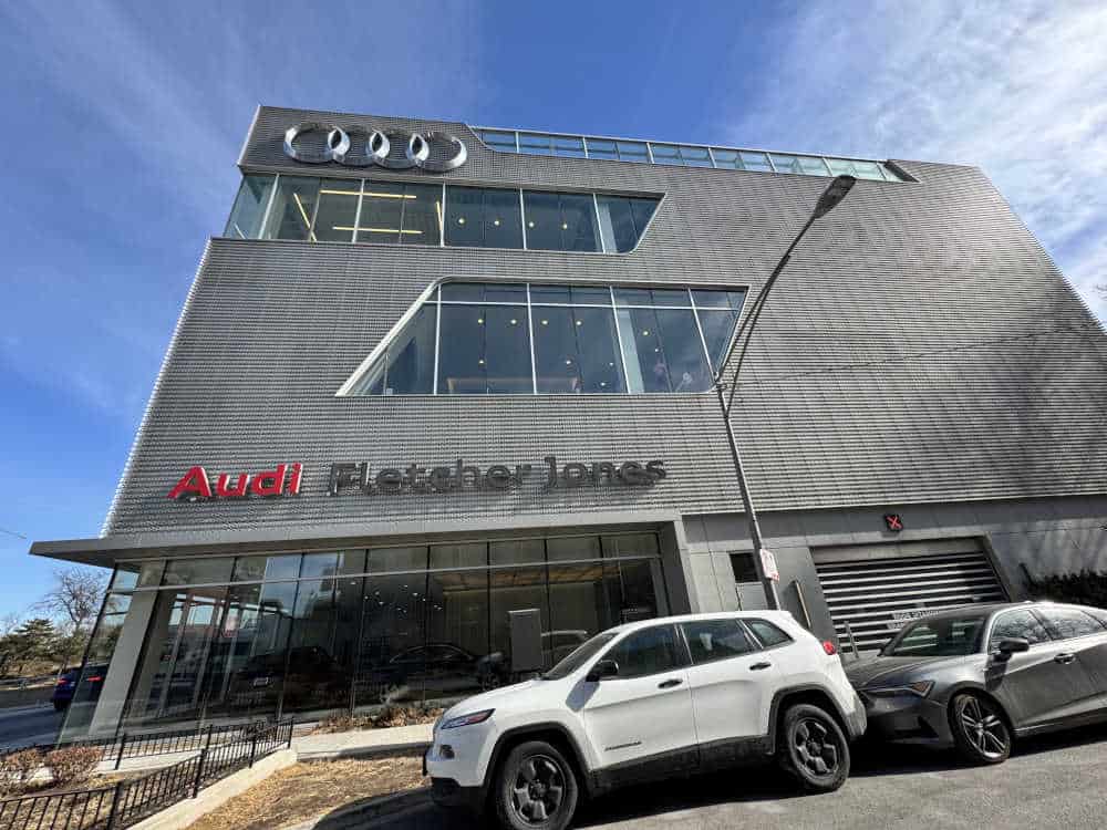 Audi Fletcher Jones Chicago Security Exterior of the Audi Fletcher Jones dealership in Chicago, showcasing a modern automotive showroom with parked vehicles, emphasizing the need for dealership protection and security solutions.